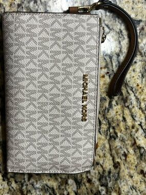Michael Kors Light Beige Signature Wristlet with Gold Logo